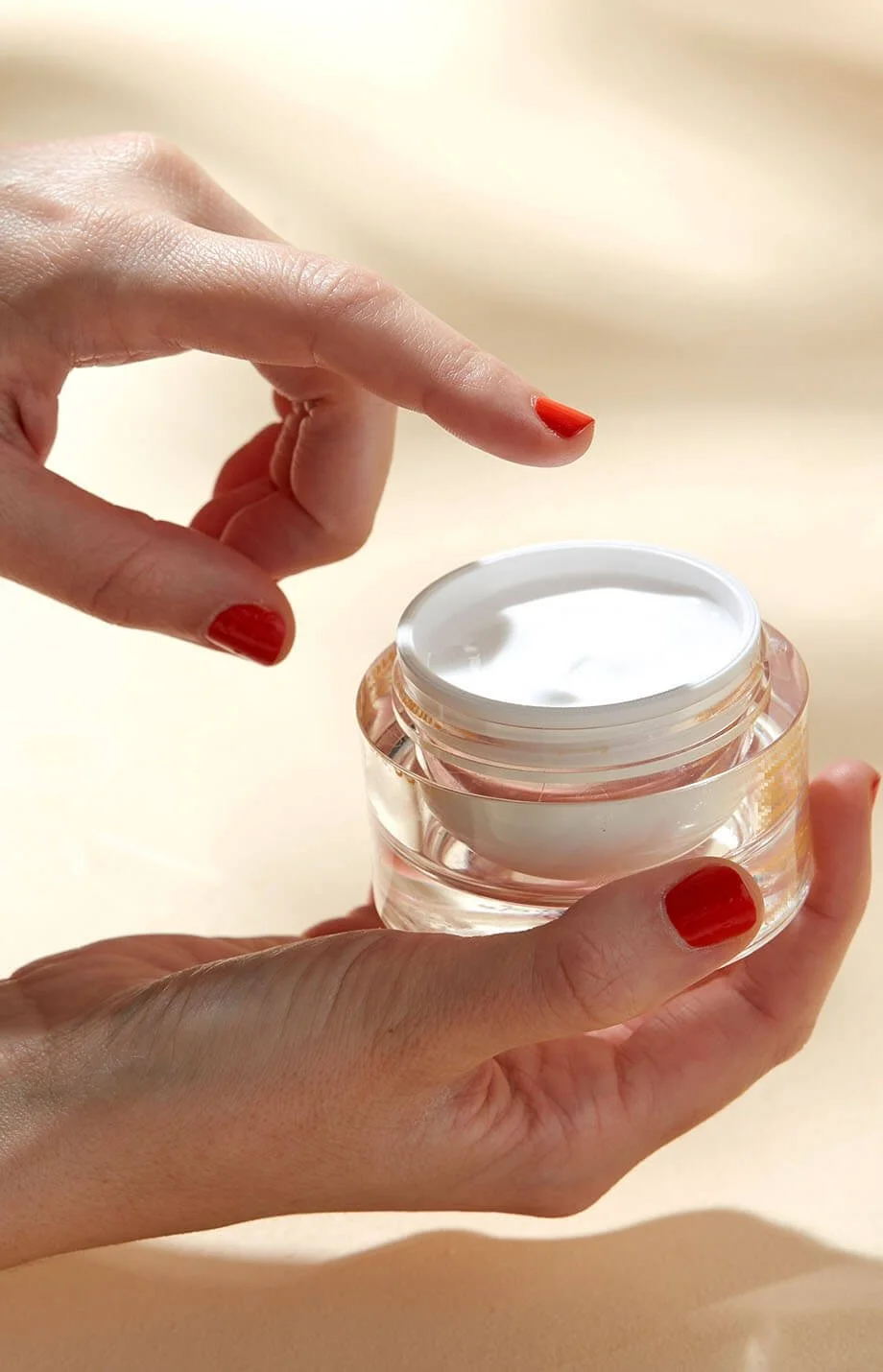 Individual using skincare product